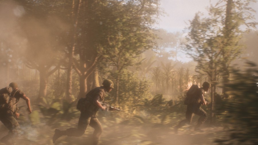 Soldiers running through smoke and dust in sunlit jungle